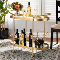 Kamal Glam Brushed Metal And Mirrored Glass 2 Tier Mobile Wine Bar Cart Gold - Baxton Studio -Furniture Sale Store GUEST 034e04a5 db63 474b 9d05 6c159816da1c